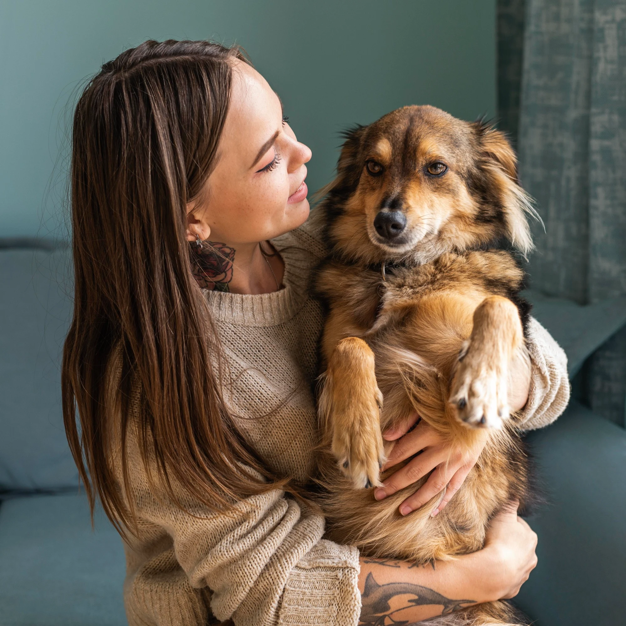Woman lovingly holding her dog